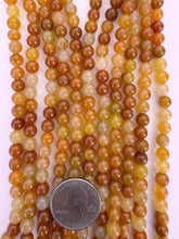 red aventurine, 6mm round, 15" strand,  SOLD PER STRAND