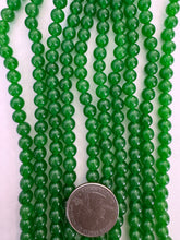 color enhanced quartz: emerald green, 6mm round, 15" strand,  SOLD PER STRAND