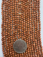 goldstone, 4mm faceted round, 15" strand,  SOLD PER STRAND