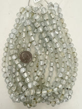 clear yellowed metallic inside lined motif, vintage look glass, 9mm melon cut round, 15" strand, sold per strand