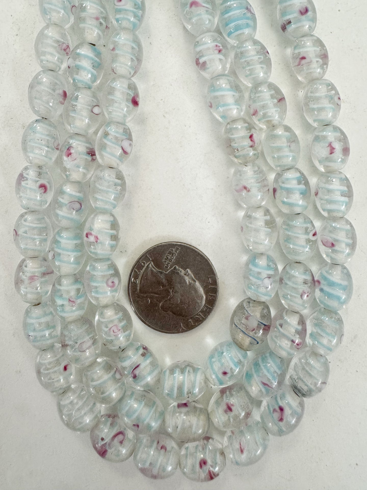 clear light pale blue white magenta swirl motif, vintage look glass, 11x9mm bowed tube, 15