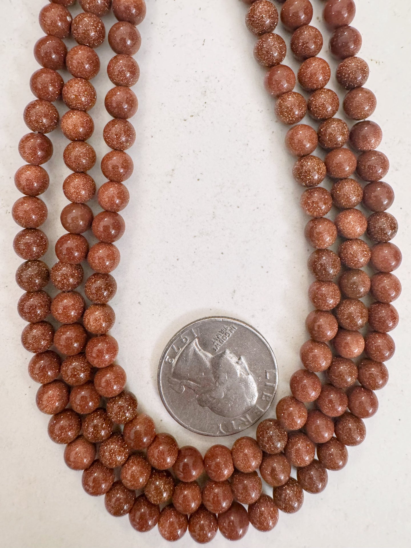 goldstone, 6mm round, 15