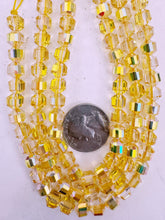 yellow AB flash coated clear, fancy cut, vintage look glass, 7mm faceted bicone barrel, 9.5" strand, sold per strand