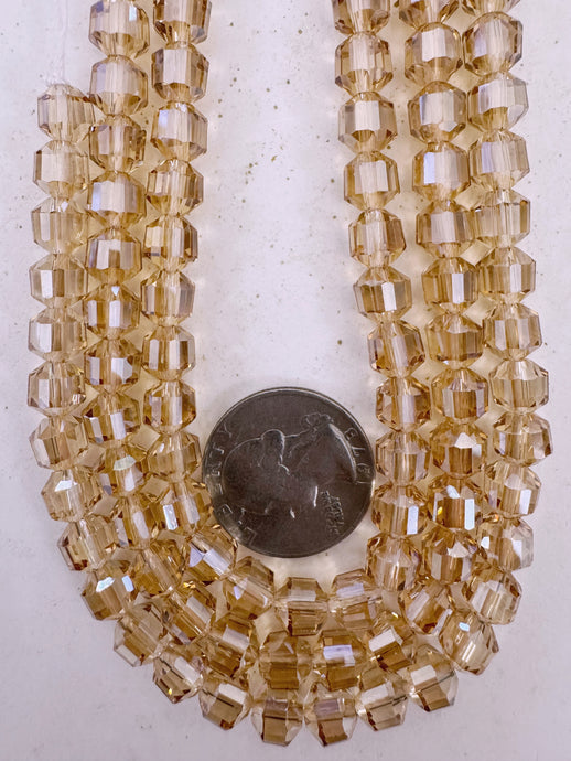 white flash coated dark peach, fancy cut, vintage look glass, 7mm faceted bicone barrel, 9.5