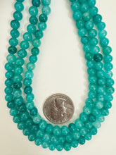 electric teal blue color enhanced quartz, 6mm round, 15" strand, sold per strand