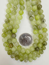 pale light lime green color enhanced quartz, 8mm round, 15" strand, sold per strand