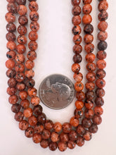 red orange color enhanced serpentine, 6mm faceted round, 15" strand, sold per strand