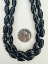 onyx, 16x7mm bowed rice tube, 15" strand, sold per strand