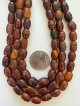red golden vintage stock horn, 12x9mm barrel, 15" strand, SOLD PER STRAND
