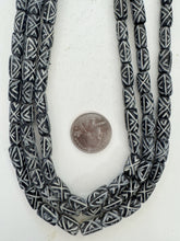 black off white, carved x pattern motif, vintage stock bone, 12x7mm barrel tube, 15" strand, SOLD PER STRAND