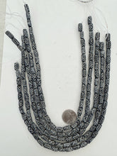 black off white, carved x pattern motif, vintage stock bone, 12x7mm barrel tube, 15" strand, SOLD PER STRAND