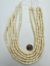 off white, carved x motif, vintage stock bone, 12x6mm tube, 15" strand, SOLD PER STRAND