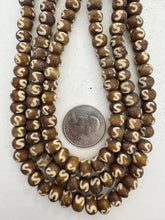golden brown off white, s motif, vintage stock bone, 8x6mm rondelle, 15" strand, SOLD PER STRAND