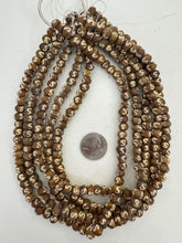 golden brown off white, s motif, vintage stock bone, 8x6mm rondelle, 15" strand, SOLD PER STRAND