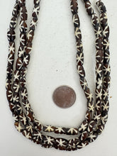 dark brown off white, starburst motif, vintage stock bone, 12x6mm rondelle, 15" strand, SOLD PER STRAND