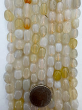 color enhanced chalcedony: pale gray yellow, 12x8mm mixed nugget, 15" strand,  SOLD PER STRAND