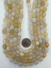 color enhanced chalcedony: pale gray yellow, 12x8mm mixed nugget, 15" strand,  SOLD PER STRAND