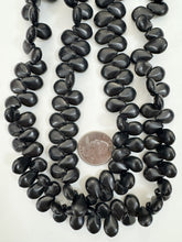 black stone, 17x13x7mm faceted flat oval, 15" strand, sold per strand