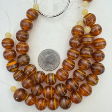 burnt orange copper orange, swirl motif, vintage stock glass, 13x12mm rondelle,  6" strand, SOLD PER STRAND