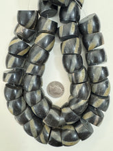 black off white golden horn, spiral motif, 26x22mm slice rondelle, 15" strand, sold per strand