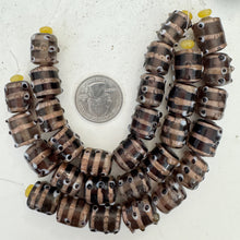 brown purple black white copper, eye swirl motif, vintage stock glass, 15x13mm raised dots barrel, 6" strand, SOLD PER STRAND