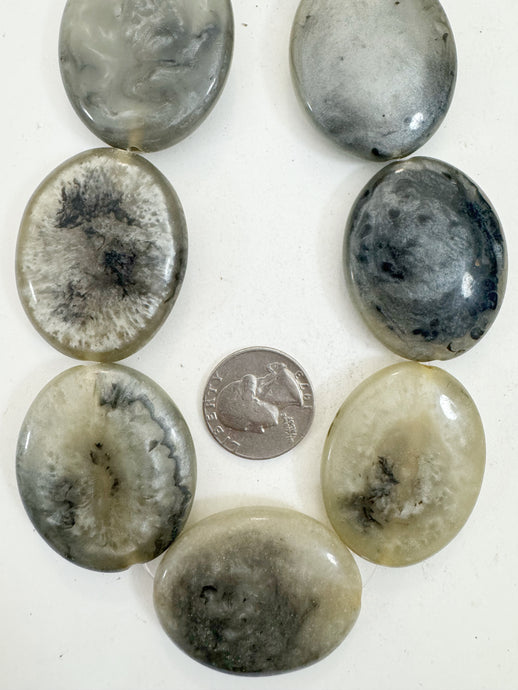 pearly pale yellow gray black swirl, vintage look resin, 42x34x9mm oval, 15