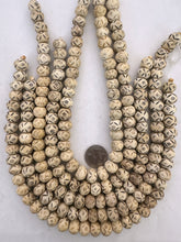 off white, carved dark eye lines motif, ancient look vintage stock bone, 14x11mm rondelle, SOLD PER STRAND