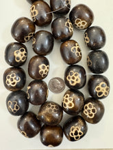 dark brown off white flower motif, faux bone, vintage look resin, 33x29mm barrel, 15" strand, sold per strand