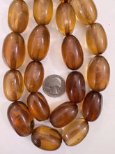 dark peach tones mix, vintage look resin, 31-33mm window cut bowed tube mix, 15" strand, sold per strand