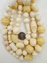 off white carved shape mix, faux bone, vintage look resin, 15" strand, sold per strand