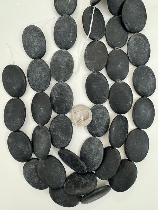 matte black stone, 35x25x5mm oval, 15