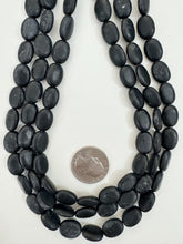 matte black stone, 13x10x5mm oval, 15" strand, sold per strand, surface wear