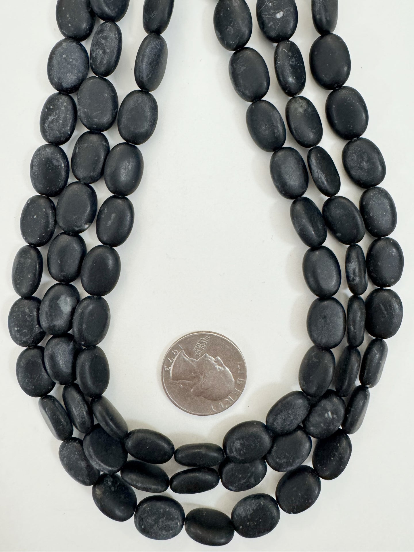 matte black stone, 13x10x5mm oval, 15