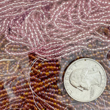 Ab coated dark amber orange metallic inside lined pink, glass, 2mm rondelle mix seed beads, approximately 418 gram bag, sold per bag, made in czech republic