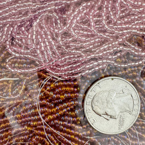 Ab coated dark amber orange metallic inside lined pink, glass, 2mm rondelle mix seed beads, approximately 418 gram bag, sold per bag, made in czech republic