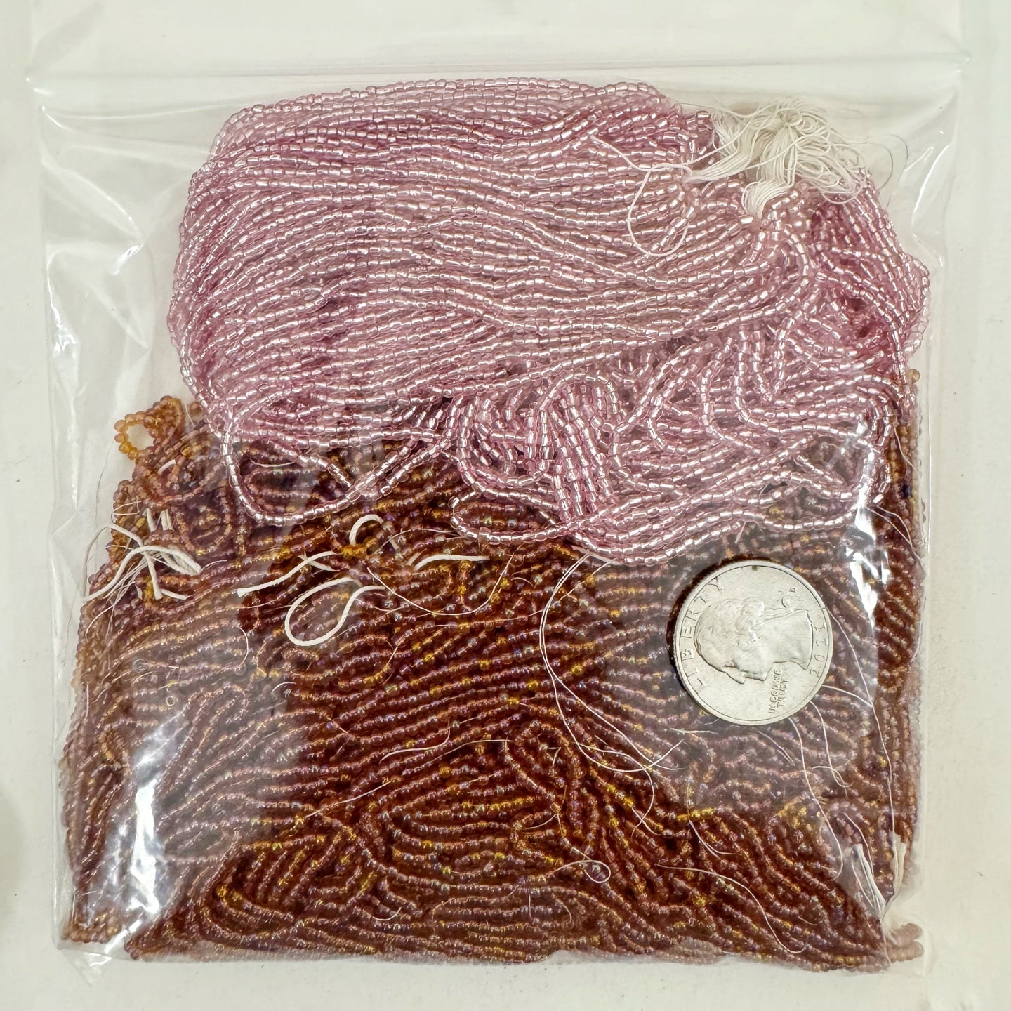 Ab coated dark amber orange metallic inside lined pink, glass, 2mm rondelle mix seed beads, approximately 418 gram bag, sold per bag, made in czech republic
