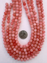 color enhanced quartz: coral pink, 8mm round, 15" strand, SOLD PER STRAND (some beads have dried rubber band on surface)