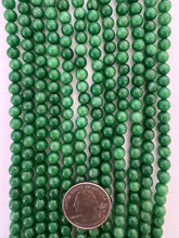 color enhanced quartz: emerald green, 6mm round, 15" strand,  SOLD PER STRAND