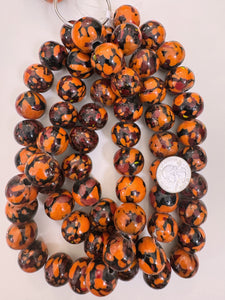 pale orange red black mix spotted swirl motif, vintage look glass, 20x18mm rondelle mix, 15" strand, sold per strand