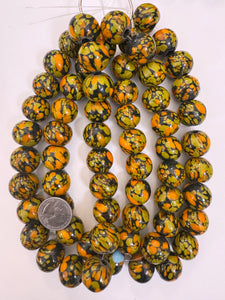pale orange olive yellow black mix spotted swirl motif, vintage look glass, 20x18mm rondelle mix, 15" strand, sold per strand