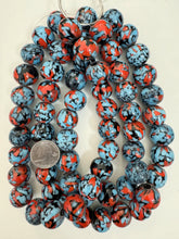 pale sky blue red black mix spotted swirl motif, vintage look glass, 20x18mm rondelle mix, 15" strand, sold per strand