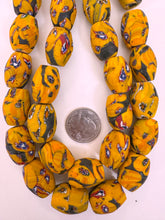 matte pale red orange red blue white black millefiori motif, vintage look glass, 24x18mm bowed tube barrel mix, 15" strand, sold per strand