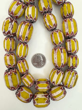 yellow red white black chevron motif, old stock vintage glass, 21-31mm barrel mix, 15" strand, sold per strand