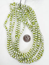 clear lime green metallic silver stripe inside lined motif, vintage look glass, 7mm round, 15" strand, sold per strand