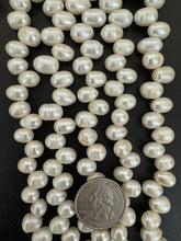 slightly off white, vintage stock fresh water pearl, 11x8mm side drilled potato, 14.5" strand,  standard pearl size hole, SOLD PER STRAND