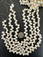 slightly off white, vintage stock fresh water pearl, 11x8mm side drilled potato, 14.5" strand,  standard pearl size hole, SOLD PER STRAND