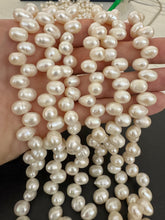 slightly off white, vintage stock fresh water pearl, 11x8mm side drilled potato, 14.5" strand,  standard pearl size hole, SOLD PER STRAND
