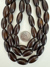 dark brown faux bone motif, vintage look resin, 19x11mm bowed tube, 15" strand, sold per strand