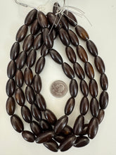 dark brown faux bone motif, vintage look resin, 19x11mm bowed tube, 15" strand, sold per strand