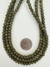 matte dark olive green black, buddha motif,  carved design, vintage look acrylic, 6mm round, 15" strand, sold per strand